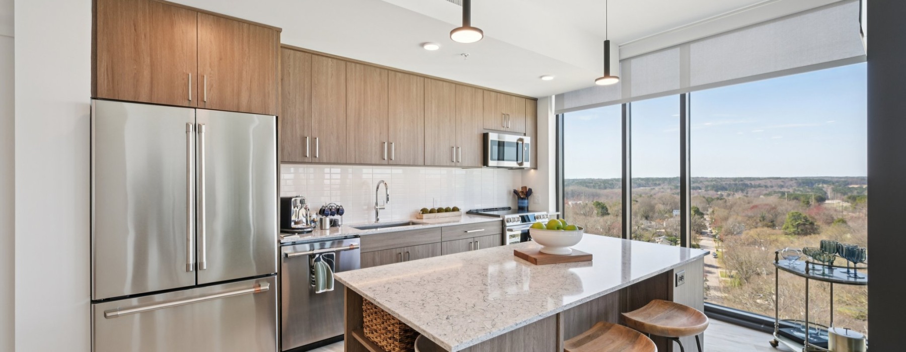 kitchen with large island and floor to ceiling windows