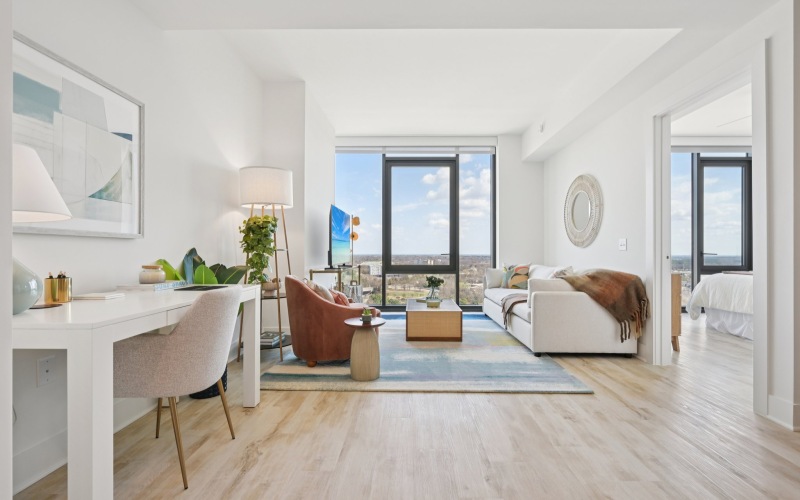 living room with floor to ceiling windows