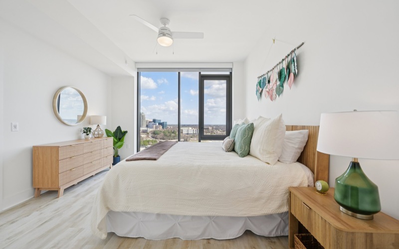bedroom with floor to ceiling windows