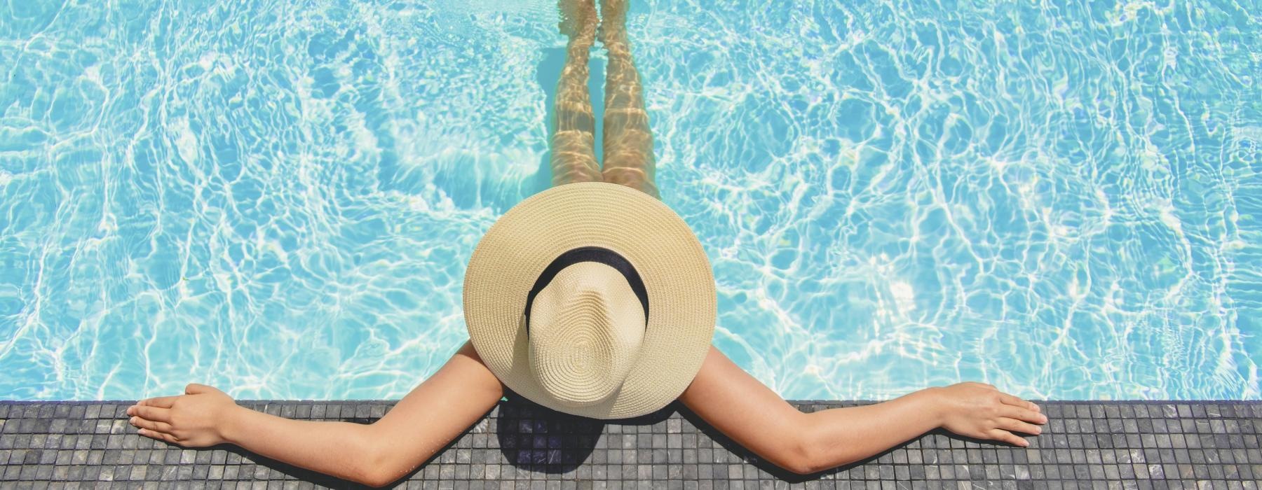 a person lying on their back in a pool