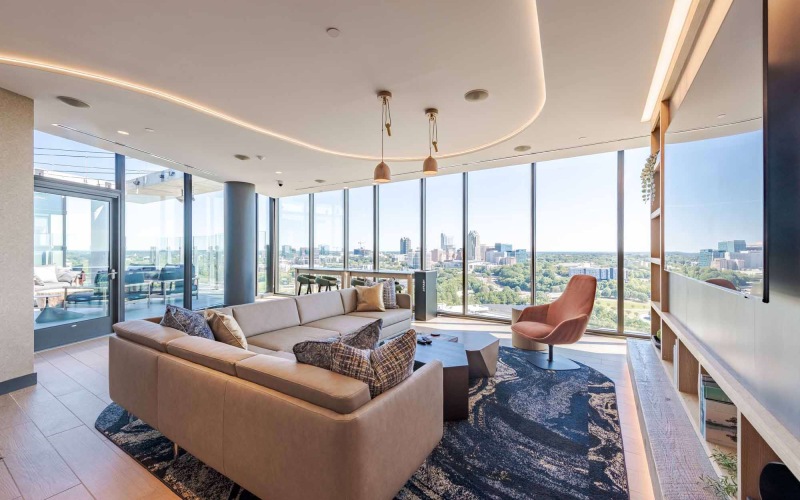 lounge seating with tv and large windows