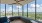 corner office with large windows and bench seating