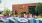 exterior of a brick building with people walking next to it