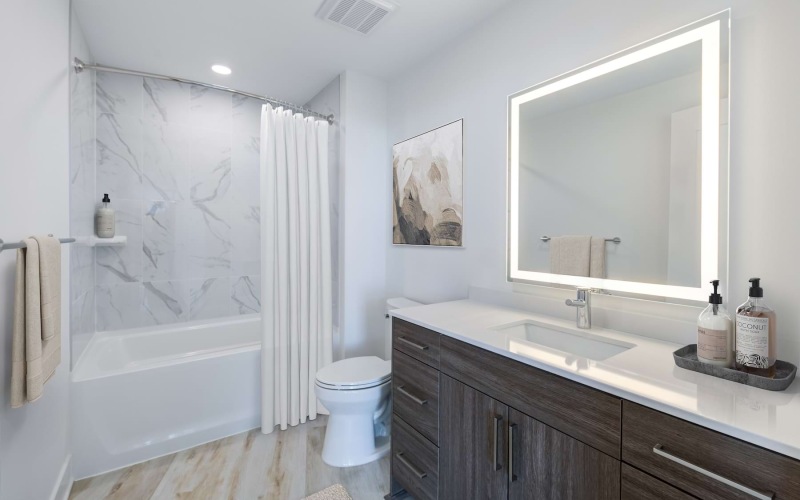 bathroom with a large mirror